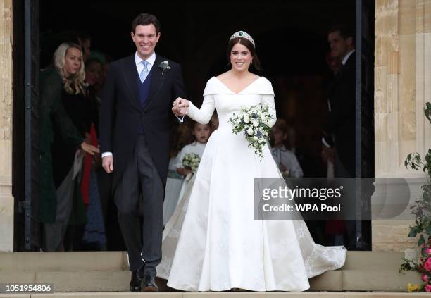 Princess Eugenie of York and her husband Jack Brooksbank on the steps of St George's Chapel after their wedding at St. George's Chapel on October 12,...