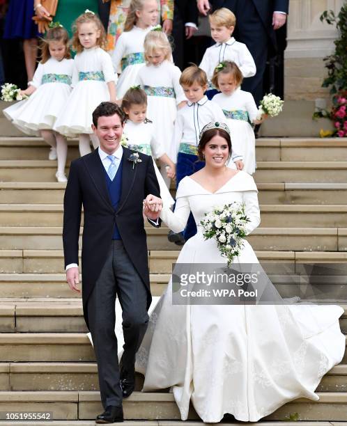 Princess Eugenie of York and her husband Jack Brooksbank leave after wedding at St. George's Chapel on October 12, 2018 in Windsor, England.