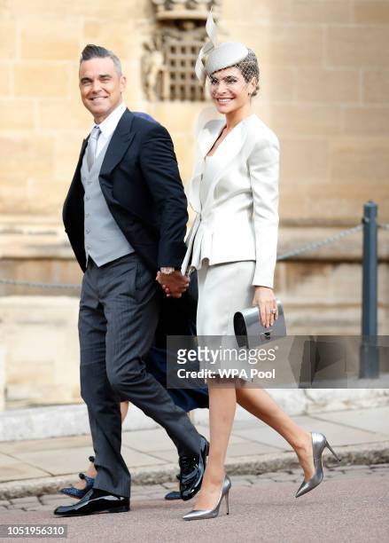Robbie Williams and his wife Ayda Field arrive ahead of the wedding of Princess Eugenie of York and Mr. Jack Brooksbank at St. George's Chapel on...