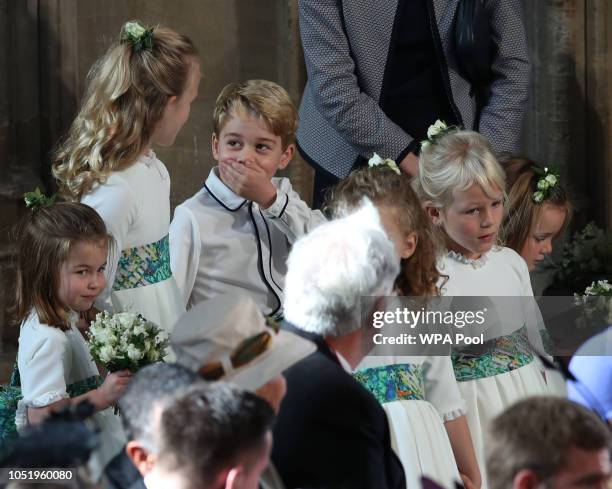 The bridesmaids and page boys, including Prince George and Princess Charlotte , arrive ahead of the wedding of Princess Eugenie of York and Mr. Jack...