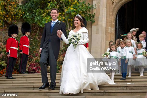 Princess Eugenie of York and Jack Brooksbank leave St George's Chapel in Windsor Castle following their wedding at St. George's Chapel on October 12,...