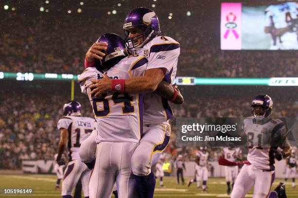 Brett Favre and Randy Moss of the Minnesota Vikings celebrate after Moss caught a 37-yard touchdown pass from Favre in the third quarter against the...