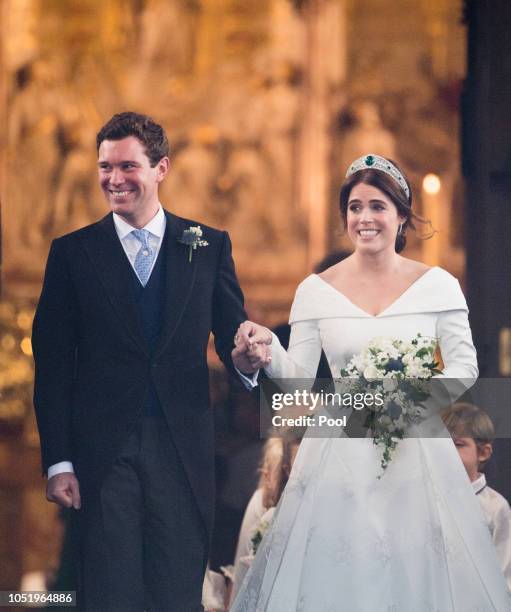 Princess Eugenie of York and Jack Brooksbank leave St George's Chapel in Windsor Castle following their wedding at St. George's Chapel on October 12,...