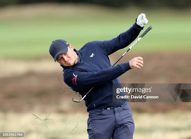 Eddie Pepperell of England plays his second shot on the second hole from the deep heather which caused him to let go of his club during the second...