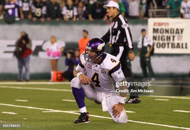 Quarterback Brett Favre of the Minnesota Vikings looks on as he picks himself up off the turf in the second half against the New York Jets at New...