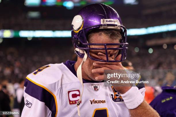 Brett Favre of the Minnesota Vikings wipes his eyes as he walks off the field after the New York Jets won 29-20 at New Meadowlands Stadium on October...