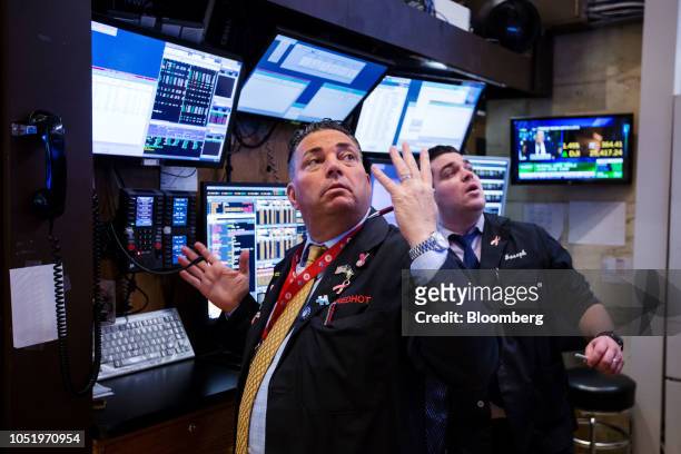 Traders work on the floor of the New York Stock Exchange in New York, U.S., on Friday, Oct. 12, 2018. U.S. Stocks surged Friday after two days of...