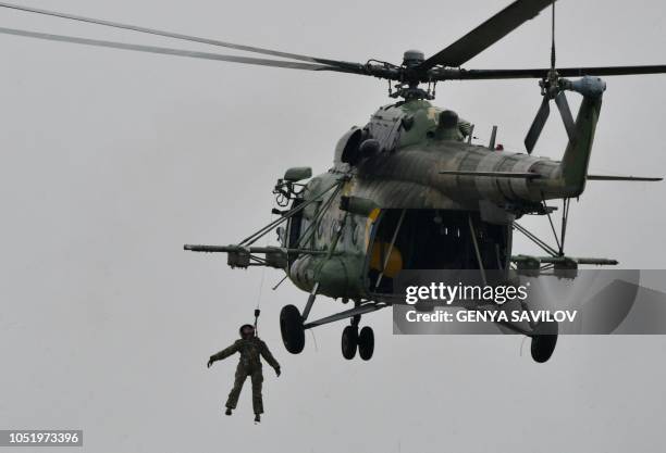 Ukrainian Mi-8 helicopter performs evacuation training for a pilot rescue during an air force exercises on Starokostyantyniv military airbase on...