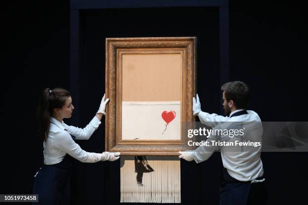 Sotheby’s unveils Banksy’s newly-titled ‘Love is in the Bin’ at Sotheby's on October 12, 2018 in London, England. Originally titled ‘Girl with...