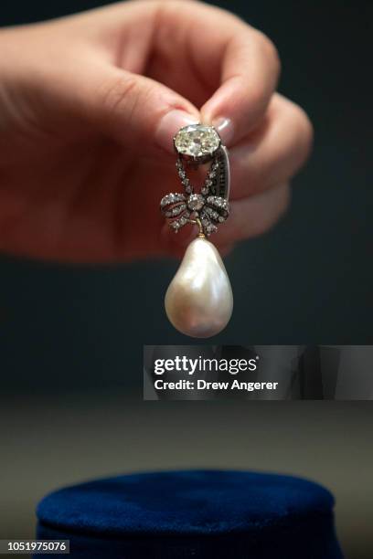 Jewelry worn by French Queen Marie Antoinette, including the pearl and diamond pendant shown here, is displayed at Sotheby's auction house, October...