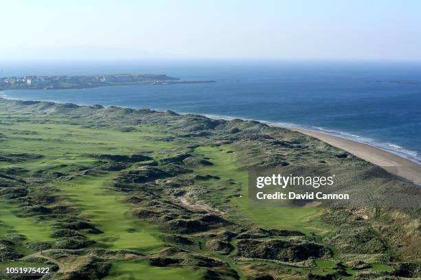 An aerial photograph looking towards the town of Portrush of the par 5, seventh hole 'Curran Point' to the right with the par 4, eighth hole...