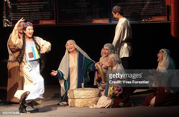 Actors perform on stage as part of the closing ceremony of the International Theatre Festival at Youth Theatre of Uzbekistan on October 11, 2010 in...