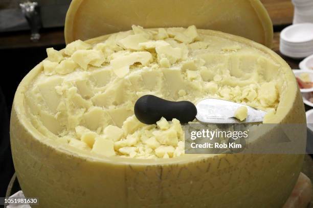 Cheese wheel on display at the Food Network & Cooking Channel New York City Wine & Food Festival presented by Capital One - Beverage Media presents...