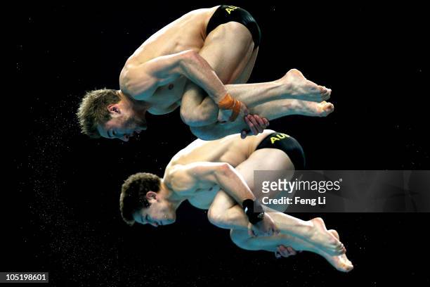 Matthew Mitcham and Ethan Wright of Australia compete in the Men's 10m Synchro Platform Final at Dr. S.P. Mukherjee Aquatics Complex on day nine of...