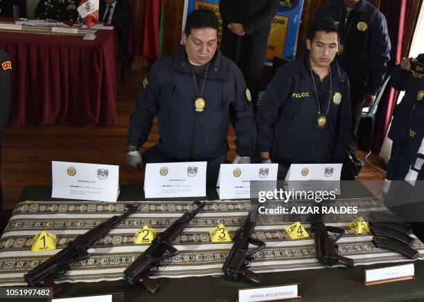 Four AKM-47 are displayed after they were handed over to the Bolivian police from the Peruvian National Police in the border city of Desaguadero,...