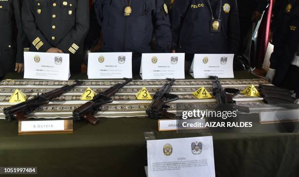 Four AKM-47 are displayed after they were handed over to the Bolivian police from the Peruvian National Police in the border city of Desaguadero,...