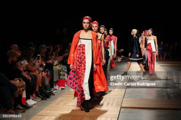 Models walk the catwalk during Ricardo Preto runway show for Day 2 - Lisboa Fashion Week 'ModaLisboa' 2018 on October 12, 2018 in Lisbon, Portugal.