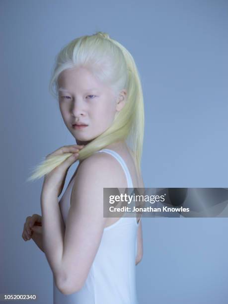 albino chinese teenage girl with ponytail - white skin stock pictures, royalty-free photos & images