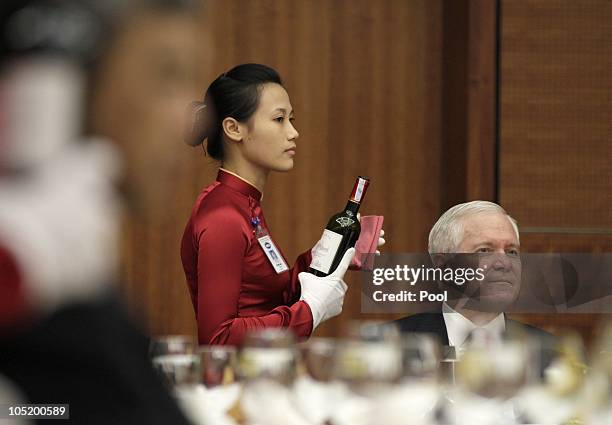 Defence Secretary Robert Gates is seated for lunch during a break in a Signing of a Joint Declaration ceremony and press conference during a meeting...