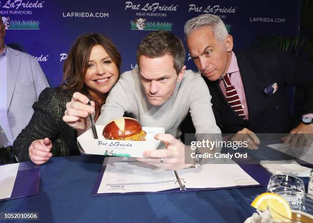 Rachael Ray, Neil Patrick Harris, and Geoffrey Zakarian judge contest entries during the Food Network & Cooking Channel New York City Wine & Food...