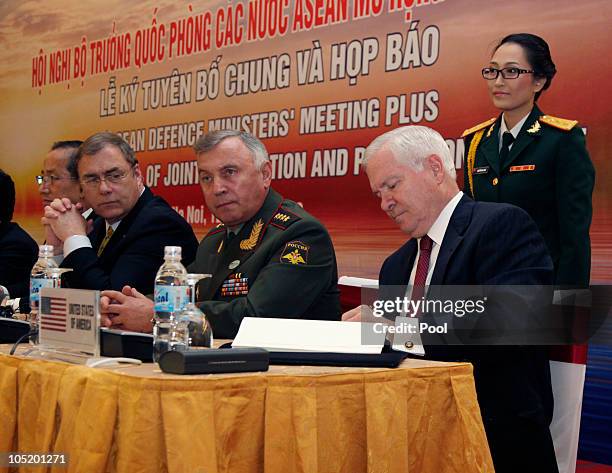 Defence Secretary Robert Gates signs a joint declaration as Russian Deputy Chief of Staff Valery Gerasimov looks on during a Signing of a Joint...