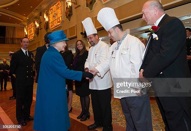 Queen Elizabeth II meets Chef Mark Oldroyd during a tour of the Cunard's new cruise-liner Queen Elizabeth II in Southampton Docks on October 11, 2010...