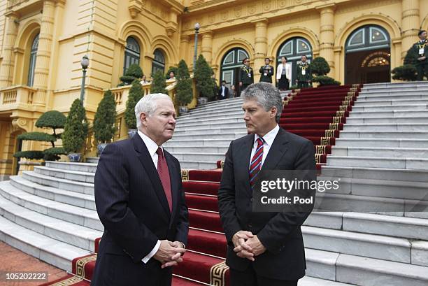 Defence Secretary Robert Gates and Australian Minister for Defence Stephen Smith talk outside the Presidential Palace as they attend a meeting of the...