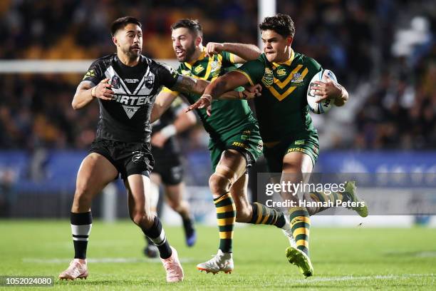 Latrell Mitchell of Australia fends off Shaun Johnson of the Kiwis during the international Rugby League Test Match between the New Zealand Kiwis and...