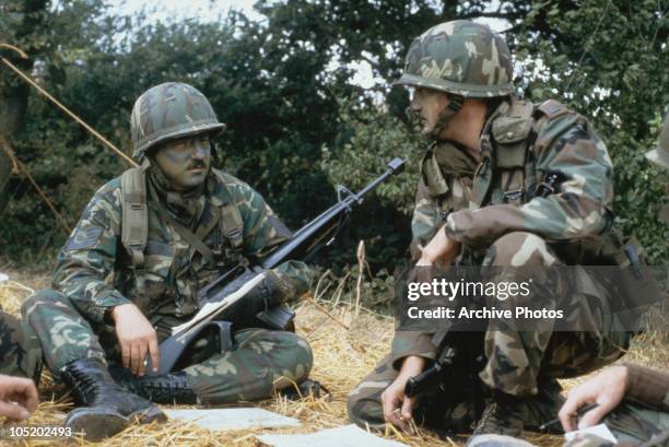 American Marines take a break during the US invasion of Grenada, 1983. The invasion was codenamed Operation Urgent Fury.