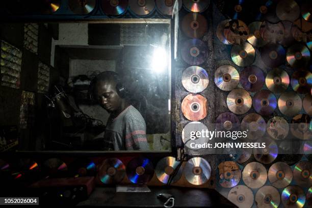Congolese hiphop enthusiast sings inside Kinshasound, one of Kinshasa's few local recording studios on October 2, 2018 in Kinshasa, in the Democratic...