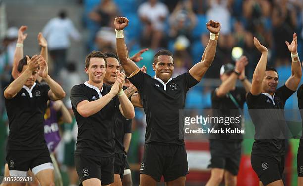The New Zealand team celebrate after winning the rugby 7's Gold Medal match between New Zealand and Australia at Delhi University during day nine of...