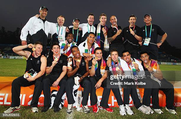 The New Zealand team pose with their gold medals as they celebrate winning the rugby 7's Gold Medal match between New Zealand and Australia at Delhi...