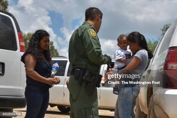 Two young mothers from Honduras, L and R, and their respective children - a 12-year-old, blocked, and 1-year-old - are detained by United States...