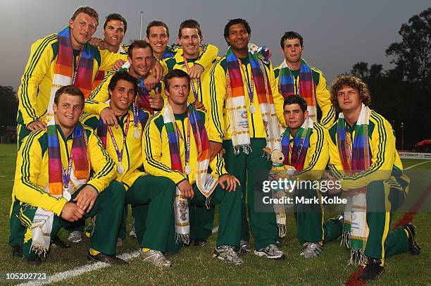 The Australian team pose with their silver medals after losing the rugby 7's Gold Medal match between New Zealand and Australia at Delhi University...