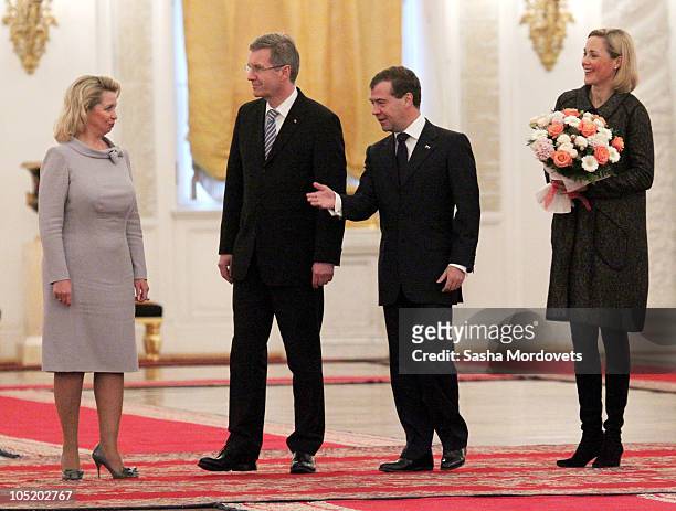 Svetlana Medvedev, German President Christian Wulff, Russian President Dmitry Medvedev and Bettina Wulff during a welcoming ceremony at the Kremlin...