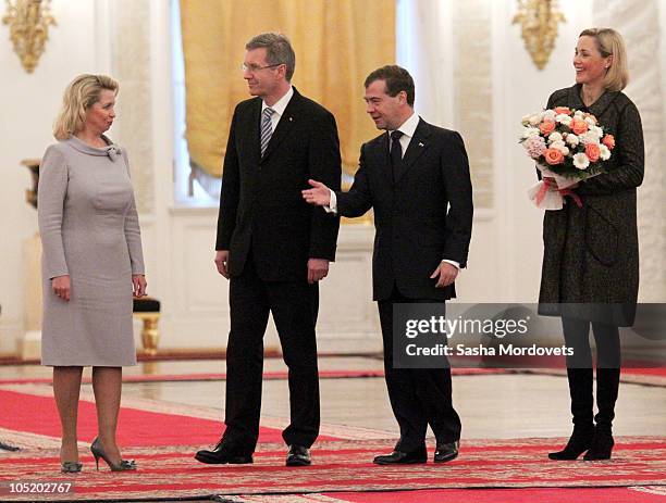 Svetlana Medvedev, German President Christian Wulff, Russian President Dmitry Medvedev and Bettina Wulff during a welcoming ceremony at the Kremlin...