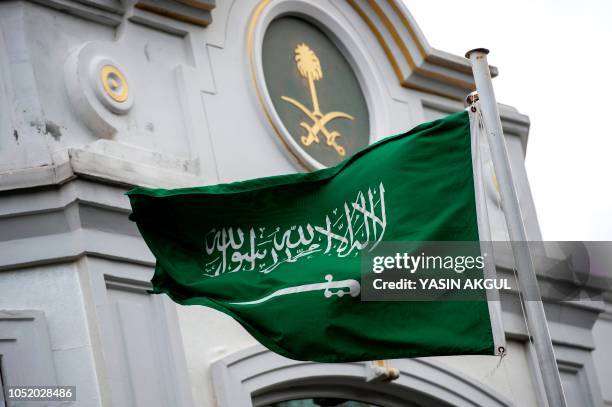 Saudi Arabia flag flies in front of the Saudi consulate in Istanbul on October 13, 2018. - Saudi Arabia dismissed on Octiber 13 accusations that...