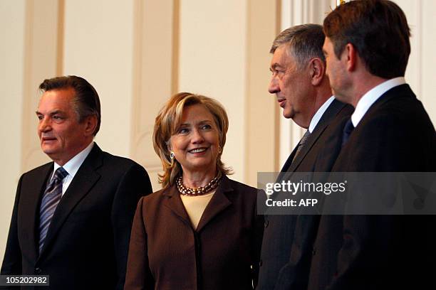 Secretary of State Hillary Clinton poses with members of the Bosnian tripartite presidency, Haris Silajdzic , Nebojsa Radmanovic and Zeljko Komsic in...