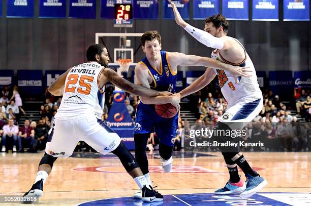 Cameron Gliddon of the Bullets takes on the defence during the round one NBL match between the Brisbane Bullets and the Cairns Taipans at Brisbane...