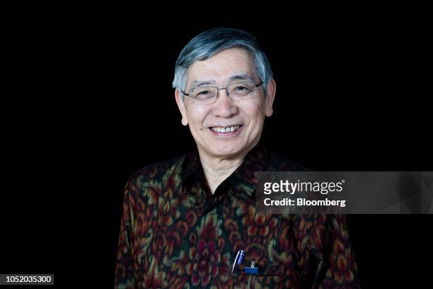 Haruhiko Kuroda, governor of Bank of Japan , poses for a photograph following a Bloomberg Television interview on the sidelines of the International...