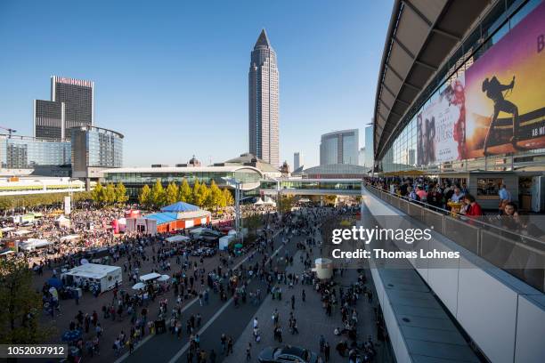 People walk over the fairground of the Frankfurt Book Fair on October 13, 2018 in Frankfurt am Main, Germany.