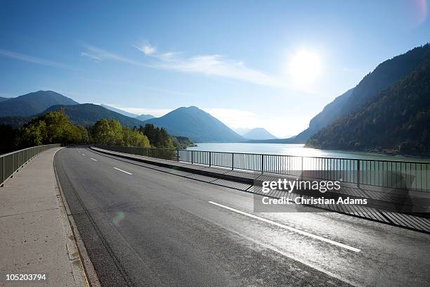 bridge over lake in sunset - sylvenstein lake bildbanksfoton och bilder