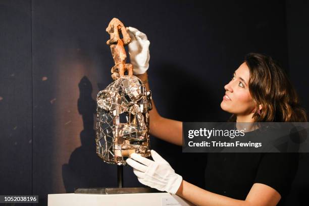 Sothebys African art specialist Adriana La Lime with Kader Attias Mirror Mask which will be offered in a sale of Modern and Contemporary African Art...