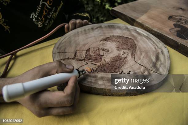 Portrait of Conor McGregor burned on a piece of wood by cook Halil Bozkurt is seen in Turkey's Hatay, on October 13, 2018. Bozkurt, uses wood burning...