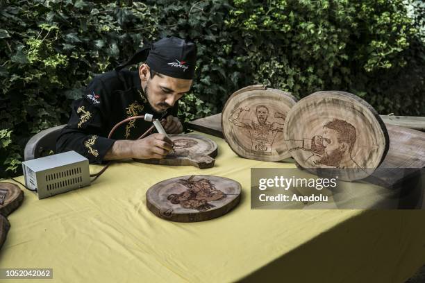 Portraits of Conor McGregor and Khabib Nurmagomedov burned on wood by cook Halil Bozkurt are seen in Turkey's Hatay, on October 13, 2018. Bozkurt,...