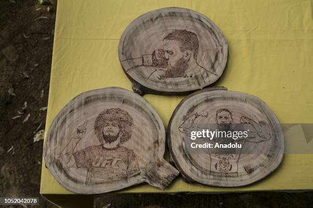 Portraits of Conor McGregor and Khabib Nurmagomedov burned on wood by cook Halil Bozkurt are seen in Turkey's Hatay, on October 13, 2018. Bozkurt,...