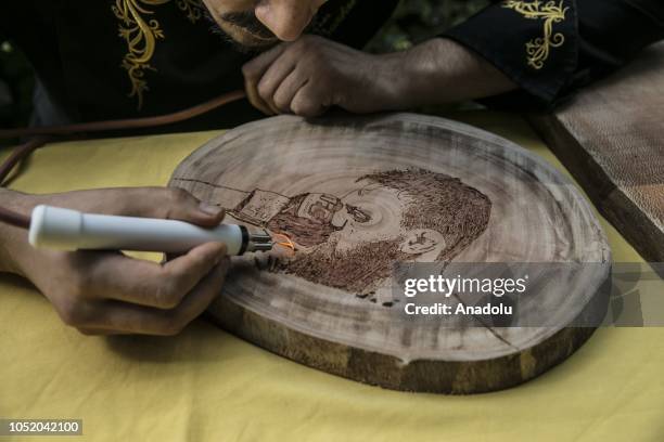 Portrait of Conor McGregor burned on a piece of wood by cook Halil Bozkurt is seen in Turkey's Hatay, on October 13, 2018. Bozkurt, uses wood burning...