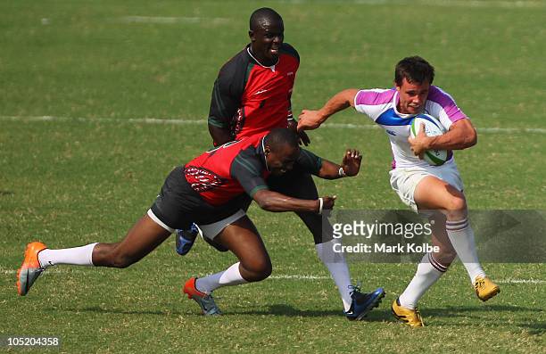 Lee Jones of Scotland makes a break on his way to scoring the winning try in golden point extra time during the rugby 7's match between Kenya and...