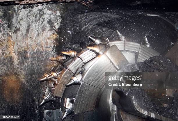 Shearer cuts away coal from in Foresight Energy LLC's Pond Creek longwall coal mine in Johnston City, Illinois, U.S., on Monday June 21, 2010. In...
