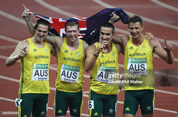 Gold medalists Kevin Moore, Joel Milburn, Sean Wroe and Brendan Cole of Australia celebrate after the men's 4 x 400 relay final at Jawaharlal Nehru...